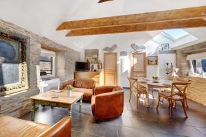 a living room with a couch and a table at Gite Ti Arzou in Le Conquet