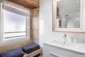 a bathroom with a sink and a window at Gite Ti Arzou in Le Conquet +12 photos
