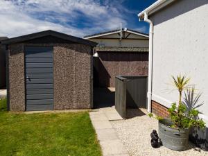 a garage in the side of a house at Lazy Daize in Saint Merryn