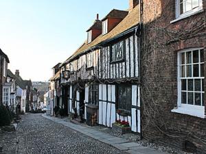 an empty street in an old town with buildings at Thornsdale Oast House in Stone