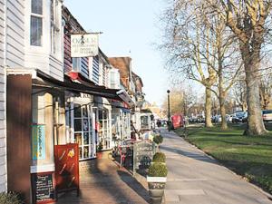 a city street with a store on the side of a building at Thornsdale Oast House in Stone