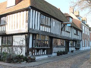an old building on the side of a street at Thornsdale Oast House in Stone +15 photos
