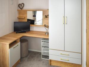 an office with a desk with a computer at Apple Grove 110 - Ukc9393 in Exmouth +4 photos