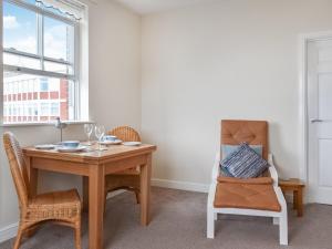 a dining room with a table and a chair at Top O' The Brewery in Scarborough