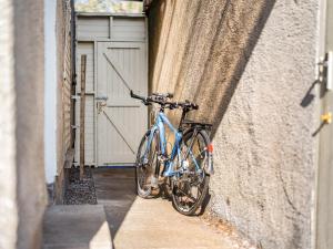 a bike leaning against a building with a door at Applepips in Stirling