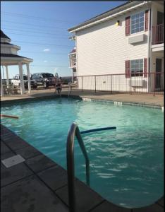 a swimming pool in front of a building at Osage Village Inn Near Lake Ozarks US 54 in Osage Beach
