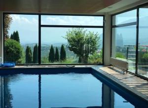 a house with a swimming pool with a view at Villa Hanan Sarajevo in Sarajevo