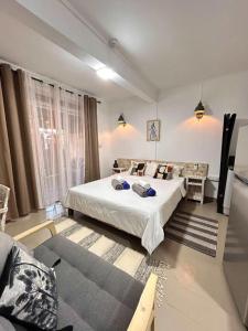 a bedroom with a large bed in a room at TRR3 Apt near Beach with Fine Cuisine & Pool in Grand-Baie +53 photos