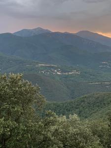 a view of a valley with mountains and trees at Le Chalet in Taillet