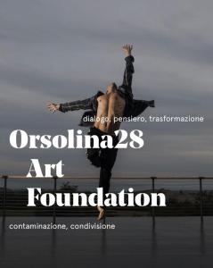 a person jumping in the air with their hands in the air at Monferrato Apartments - Ca Marì e Casa Elena in pieno centro storico in Moncalvo