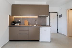 a kitchen with a sink and a counter top at PJ Properties Studio in Sounio steps away from the beach in Sounio