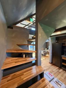 a kitchen with wooden counter tops in a room at Beringei house Kujukuri in Katakai