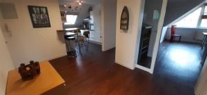 a living room with a table and a dining room at Luxuswohnung, 90 qm, Balkon, beste Lage in Kollmar in Kollmar