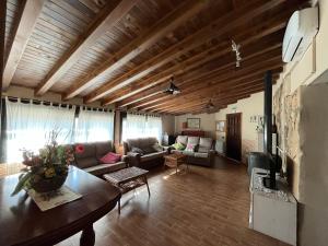 a living room with a couch and a table at Casa Rural Valle del Jerte in Jerte
