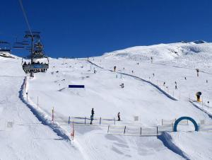 a group of people skiing down a snow covered slope at Haus Alpenblick - Silvretta Card Premium INKLUSIVE in See