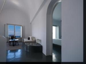 a living room with a couch and a table at Santonero in Akrotiri