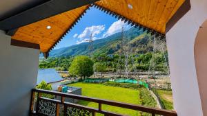 a view from the balcony of a house at Pahadon Ka Ghar in Sonāmarg