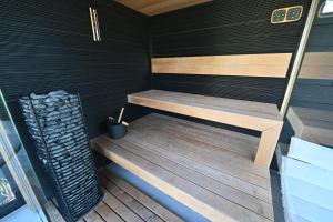 a small sauna with a wooden bench in a room at Vintage Home Vendégház in Miskolctapolca +58 photos