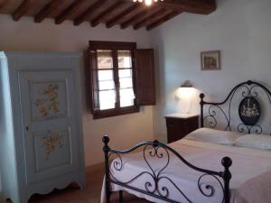 Postel nebo postele na pokoji v ubytování Antonella House -Podere della Collina