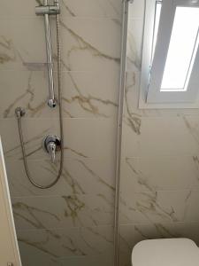 a bathroom with a shower with a glass door at Casa Mare con finestra su balcone in Polignano a Mare +14 photos
