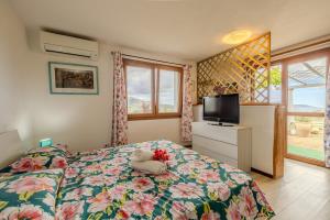 a bedroom with a teddy bear sitting on a bed at Rai's Room 1 - Nature and Panoramic View in Stazione Olbia
