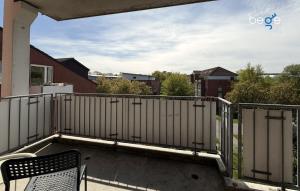 a balcony with a bench and a fence at BEGE APARTMENTS HomeAway in Marl