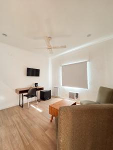 a living room with a couch and a table at Hotel Milton in La Paz +18 photos