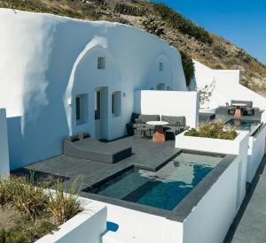 a villa with a pool and a house at Santonero in Akrotiri