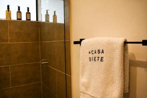 a bathroom with a towel that says casa side at Casa Siete Hotel Boutique in Bogotá +5 photos