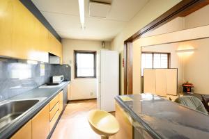 a kitchen with a sink and a refrigerator at Good MorningHouse in Takayama +44 photos