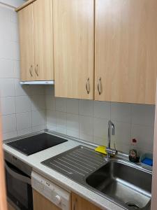 a kitchen with a sink and a counter top at Apartamento en Formigal in Formigal