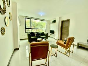a living room with a couch and chairs at Lovely 2BD City Condo with parking in Guayaquil +15 photos