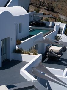 a view of a white house with a swimming pool at Santonero in Akrotiri