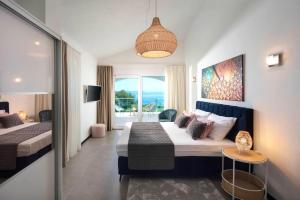 a hotel room with a bed and a window at Luxury Panorama Vila with amazing Seaview in Gondolici 7 km from Rabac in Labin +31 photos