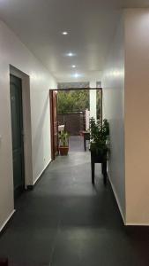 an empty hallway with plants in a building at Narjis in Dzaoudzi