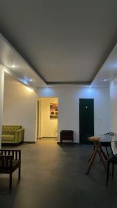 a living room with a couch and a table at Narjis in Dzaoudzi