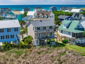 an aerial view of a residential neighborhood with houses at All Marshed Up-Stunning Water View 1 block to beach in Surf City