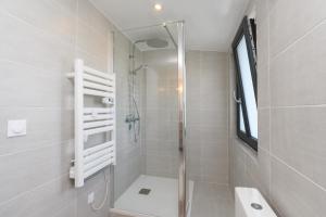 a bathroom with a shower with a glass door at Ker Marin -Maison Refuge Des Marées in Sarzeau +17 photos
