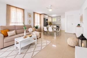 a living room with a couch and a table at DUPLEX C9 con PISCINA PRIVADA in Callao Salvaje