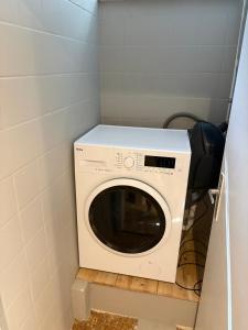 a washer and dryer in a small room at Ferienwohnung Elli in Haiterbach +2 photos