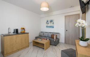 a living room with a couch and a table at Deluxe City in Chania