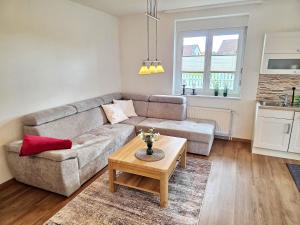 a living room with a couch and a coffee table at Am Pappelweg - ABC620 in Hohen Viecheln
