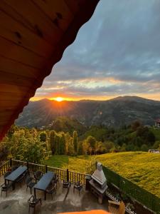 a view of the sunset from the balcony of a house at Pisa Villa-Bungalov in Topluca