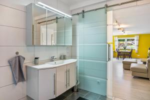a bathroom with a sink and a mirror at Fewo Franken in Goldkronach +13 photos