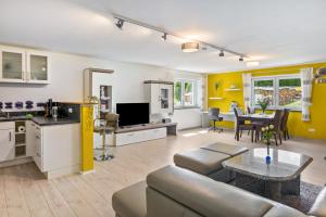 a living room with a couch and a table at Fewo Franken in Goldkronach