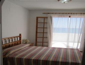 Postel nebo postele na pokoji v ubytování Apartamentos Rayos de Sol + 37 fotografií