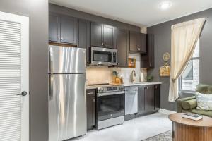 a kitchen with a stainless steel refrigerator and microwave at Park Hotel Studio Suite 311 in Chattanooga