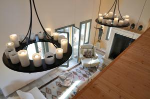 an overhead view of a living room with a chandelier at Aegea Blue Cycladic Resort in Zorgos 