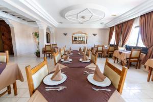 a dining room with a long table and chairs at Tiznit Hotel in Tiznit +91 photos