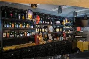 a bar with a lot of bottles of alcohol at Tiznit Hotel in Tiznit